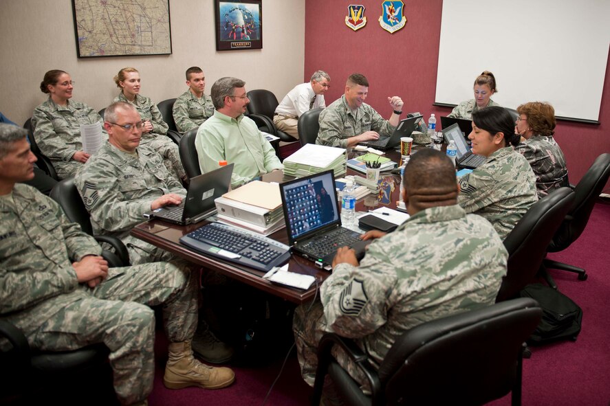 Members of the Air Traffic Systems Evaluation Program conduct an end-of-day meeting March 22 at the 23rd Operations Support Squadron base operations building, Moody Air Force Base, Ga. The team consists of 12 inspectors and three observers from Langley, Nellis, Tinker and Offutt Air Force Bases. (U.S. Air Force photo/Staff Sgt. Jamal D. Sutter)(RELEASED)