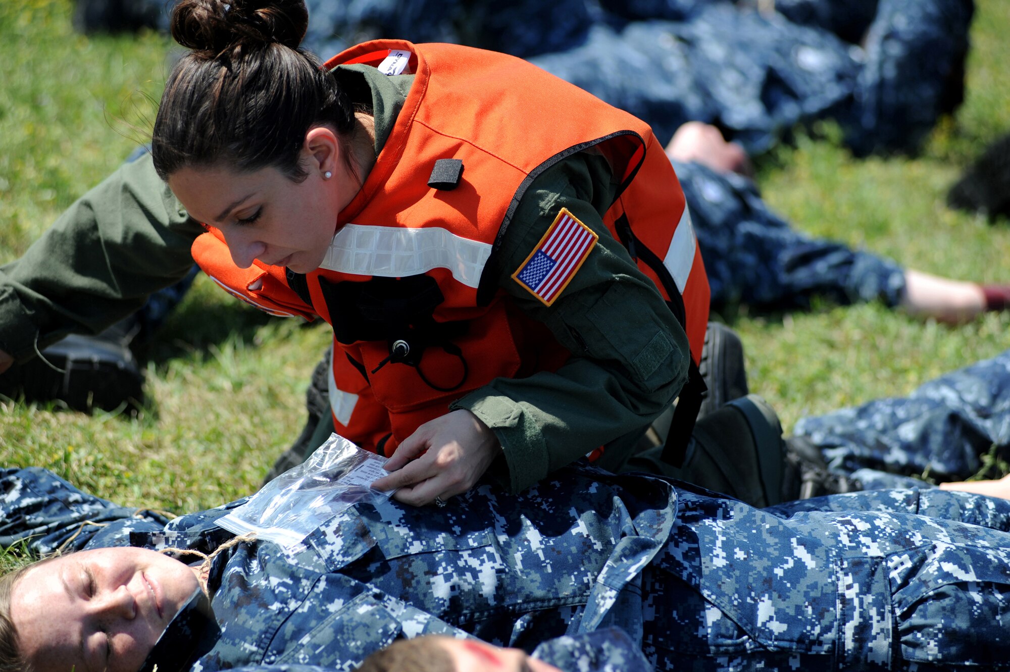 Capt. Melissa Ellis-Yarian triages a simulated victim during a Major Accident Response Exercise March 22, 2011 on Joint Base Charleston S.C.  The MARE is a necessary step to prepare all Joint Base Charleston members for the upcoming 2011 Air Expo .  The exercise is used to help test and train the supporting agencies who would respond in case of an emergency.  Captain Ellis-Yarian is a flight surgeon with the 628th Medical Group.  (U.S. Air Force photo/ Staff Sgt. Nicole Mickle)  (Released)