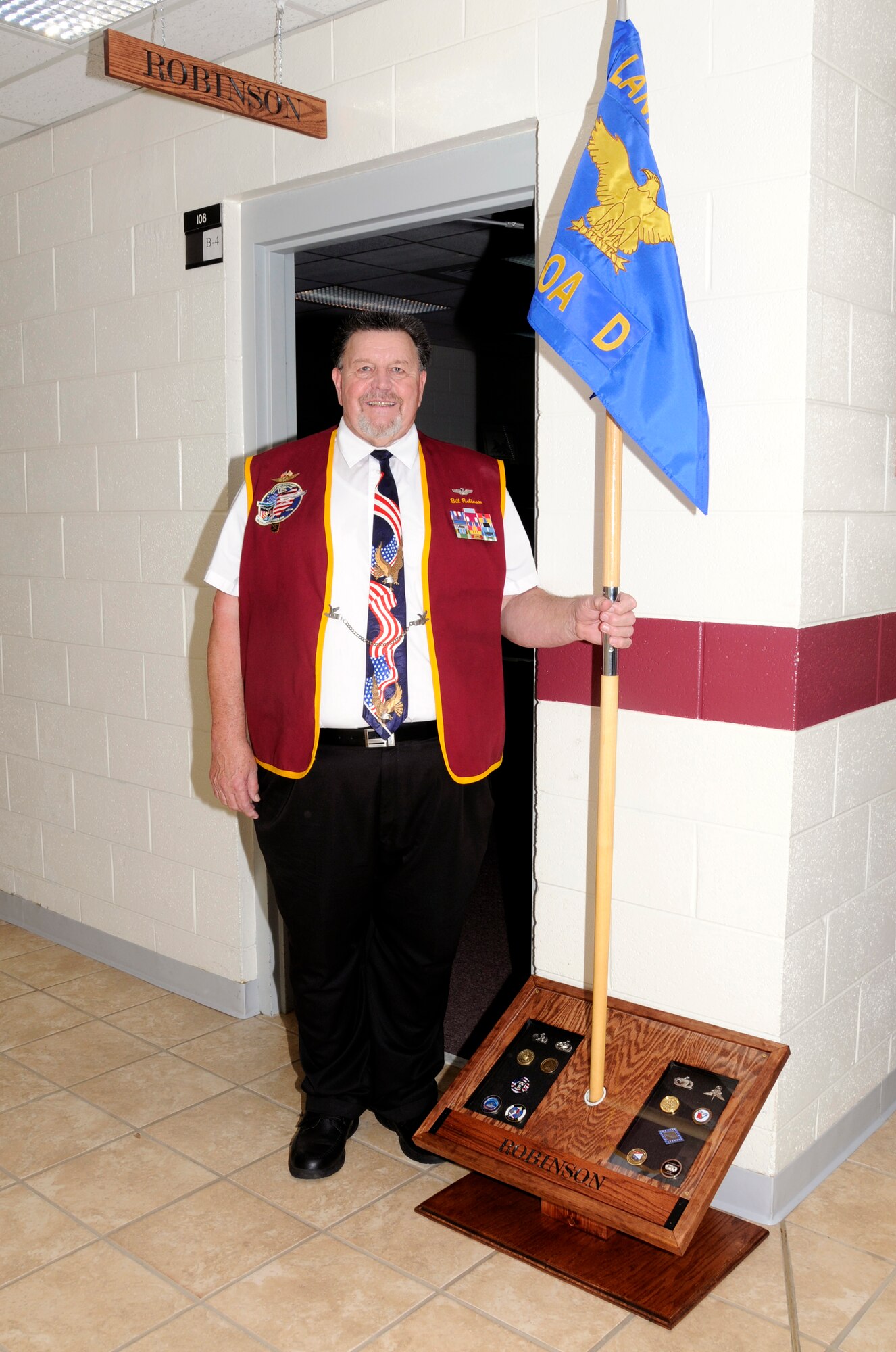 McGHEE TYSON AIR NATIONAL GUARD BASE, Tenn. - Retired Air Force Capt. William A. Robinson, the first enlisted POW of the Vietnam War, stands in front of the new "Robinson Room" at Morrisey Hall on the campus of The I.G. Brown Air National Guard Training and Education Center here, March 22, 2011.  The center dedicated the room in his honor in a tribute to enlisted heroes.  (U.S. Air Force photo by Master Sgt. Kurt Skoglund/Released)