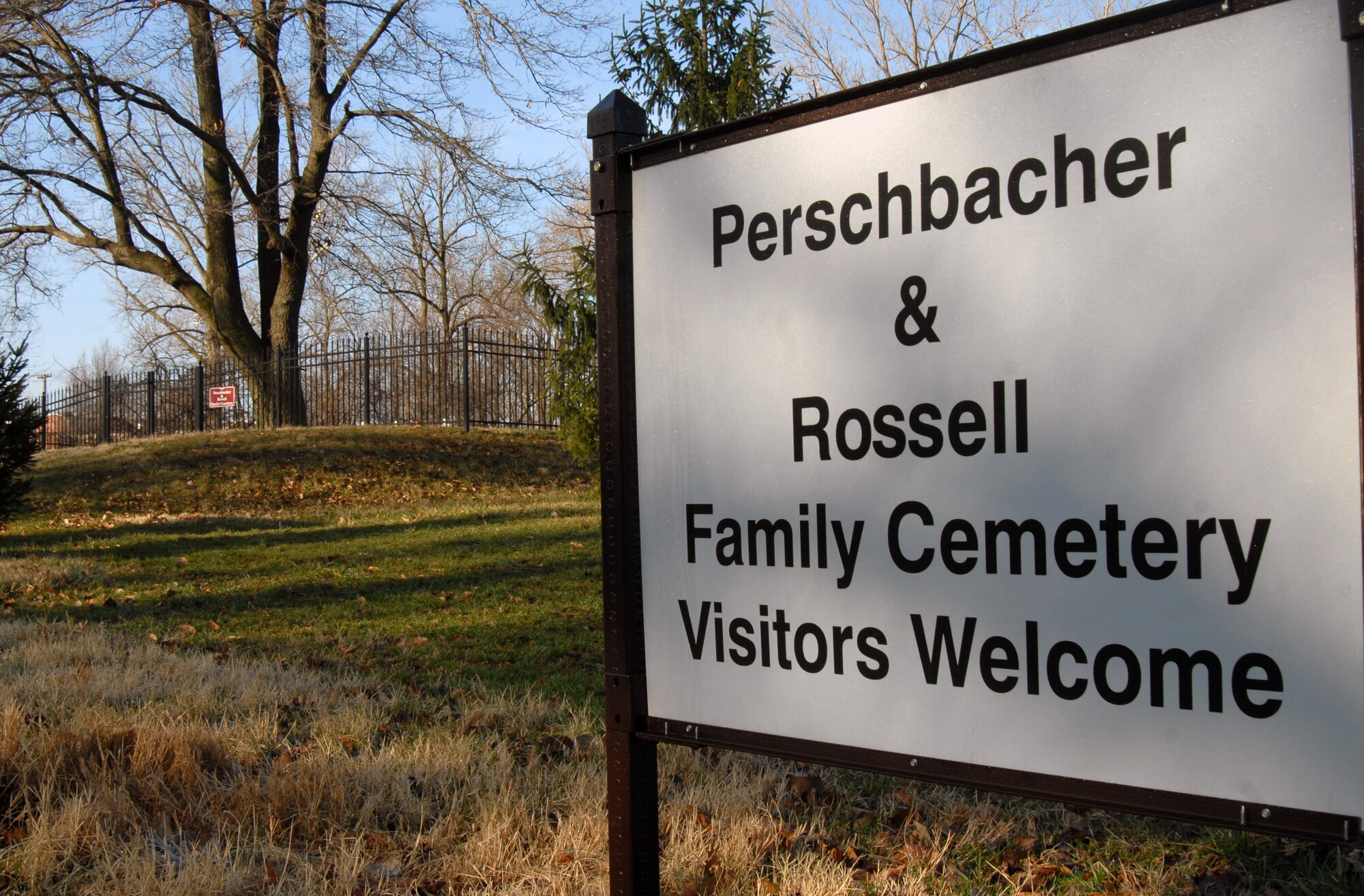 SCOTT AIR FORCE BASE, Ill. -- A welcome sign invites visitors to the Perschbacher and Rossell family cemetery located near Scott Lake. The sign is one of the many improvement and restoration projects to the cemetery which is one of two mid-nineteenth century pioneer families located on Scott. (U.S. Air Force Photo by Senior Airman Andrew Davis)