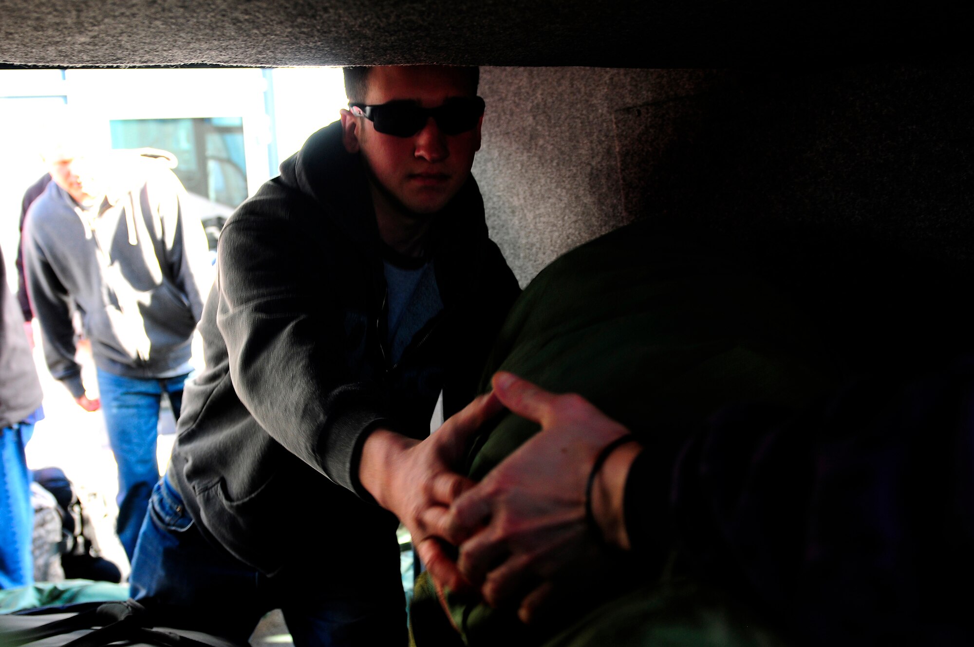 U.S. Air Force Airman 1st Class Jefferey Plut, 86th Civil Engineer Squadron, loads cargo on a bus in preparation for a deployment in support of Joint Task Force Odyssey Dawn, Ramstein Air Base, Germany, March 21, 2011. The U.S. Africa Command task force was established to provide operational and tactical command and control of U.S. military forces supporting the international response to the unrest in Libya and enforcement of United Nations Security council Resolution 1973. UNSCR 1873 authorizes all necessary measures to protect civilians in Libya under threat of attack by Qadhafi regime forces. JTF Odyssey Dawn is commanded by U.S. Navy Admiral Samuel J. Locklear, III.  (U.S. Air Force Photo by Airman 1st Class Brea Miller)