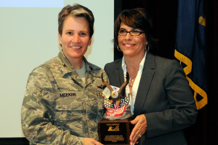 Col.Martha Meeker is recognized by Lisa Jones, the Coastal Carolina Combined Federal Campaign staff director, for leadership and outstanding support as the chair of the 2010 CCCFC JB Charleston, March 17. Colonel Meeker is the JB CHS commander. Also recognized at the ceremony were Joe Ward, and Missy Heyward, activity coordinators for the CCCFC, and Larry Brewer, CCCFC staff director. The CFC is a fundraising effort for federal employees to donate to charitable organizations of their choice. The 2010 campaign raised more than $1.5 million for charitable organizations with the help of JB Charleston. (U.S. photo/Machinist’s Mate 3rd Class Brannon Deugan)