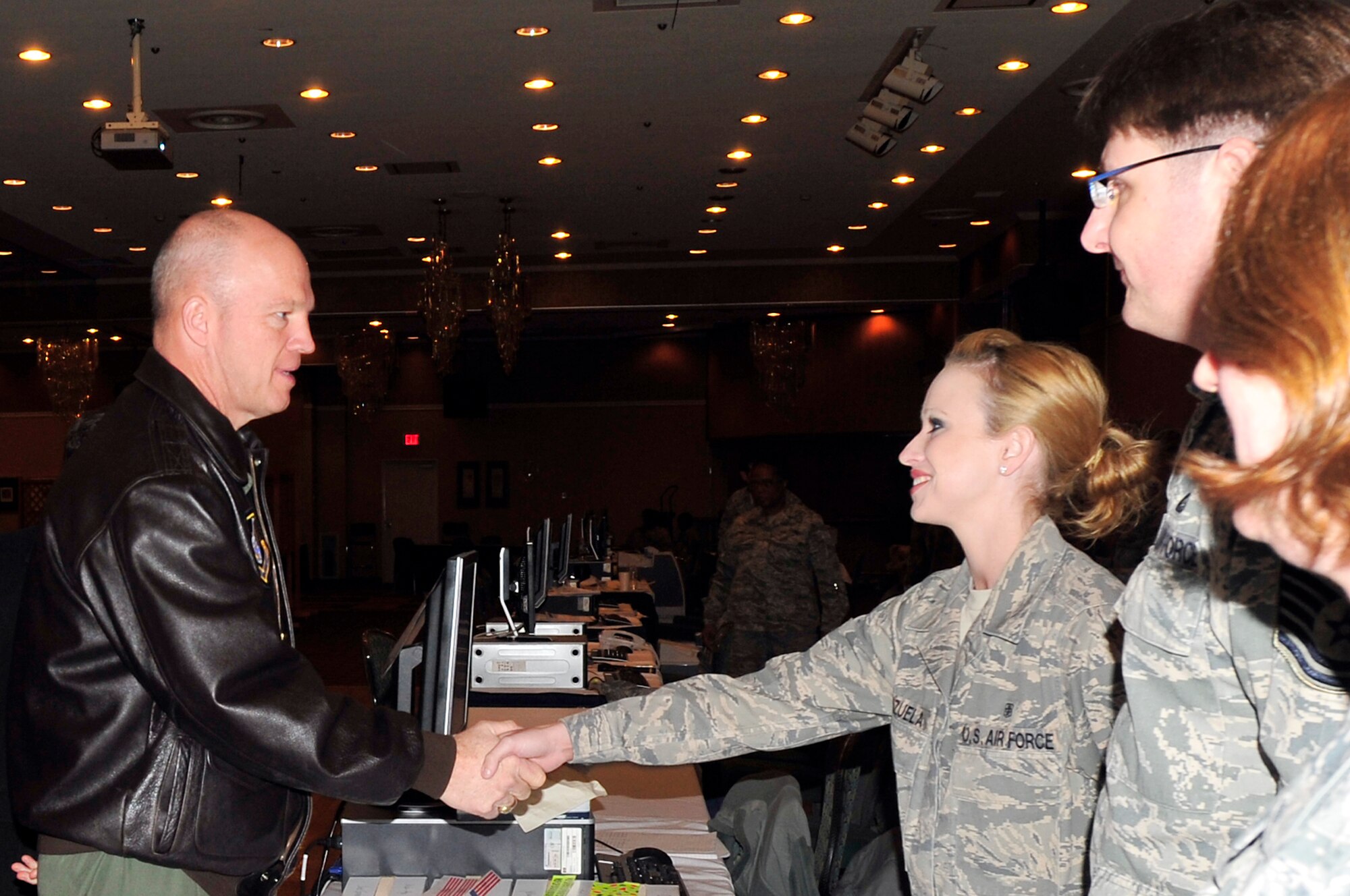 MISAWA AIR BASE, Japan -- Brig. Gen. John Raymond, 5th Air Force vice commander, greets Airmen at the consolidated collocated club Mar 23. General Raymond and Chief Master Sgt. Andy Kaiser, U.S. Forces Japan and 5th Air Force command chief, paid a brief visit to check up on the morale and welfare of the Airmen and Sailors here. (U.S. Air Force photo by Staff Sgt. Marie Brown\Released)
