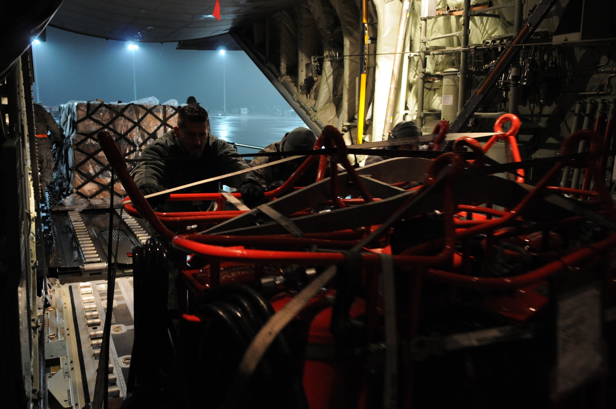 SPANGDAHLEM AIR BASE, Germany –Airmen from the 52nd Logistics Readiness Squadron load cargo onto a C-130J Hercules here for shipment in support of Operation Odyssey Dawn March 19. Joint Task Force Odyssey Dawn is the U.S. Africa Command task force established to provide operational and tactical command and control of U.S. military forces supporting the international response to the unrest in Libya and enforcement of United Nations Security Council Resolution (UNSCR) 1973. UNSCR 1973 authorizes all necessary measures to protect civilians in Libya under threat of attack by Qadhafi regime forces.  JTF Odyssey Dawn is commanded by U.S. Navy Admiral Samuel J. Locklear, III. (U.S. Air Force photo/Airman 1st Class Matthew B. Fredericks)