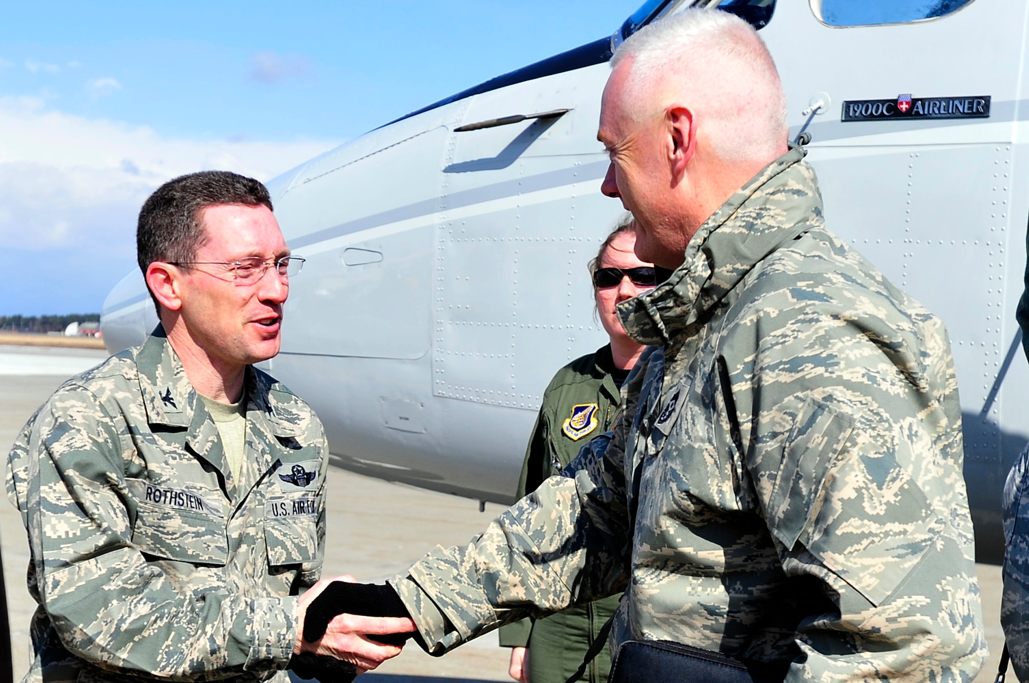 MISAWA AIR BASE, Japan -- Col. Michael Rothstein, 35th Fighter Wing commander, shakes hands with Chief Master Sgt. Andy Kaiser, U.S. Forces Japan and 5th Air Force command chief upon his arrival Mar. 23. Chief Kaiser traveled to Misawa Air Base for a brief base tour to see how the base is supporting Operation Tomodachi. (U.S. Air Force photo by Staff Sgt. Marie Brown\Released)

