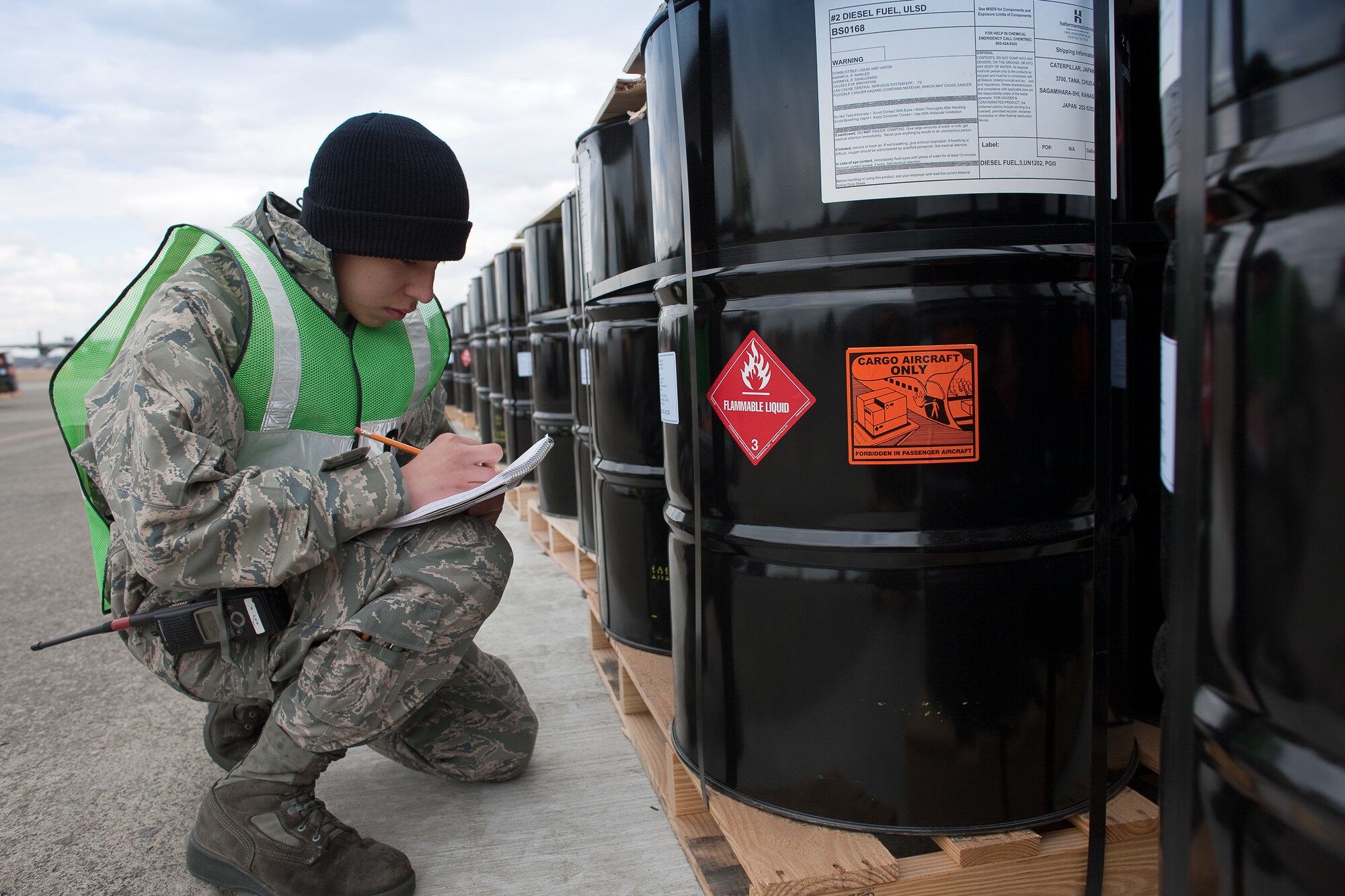 YOKOTA AIR BASE, Japan -- Airman 1st Class Isaac Perez, 374th Maintenance Squadron, takes an inventory before shipping 116 pallets of diesel fuel at Yokota Air Base March 23. The 374th LRS prepared the fuel for shipment to the Caterpillar factory in Sagamihara. The plant, which employees thousands and manufactures equipment critical to the rebuilding of Japan, currently runs on generator power. (U.S. Air Force photo/Osakabe Yasuo) 