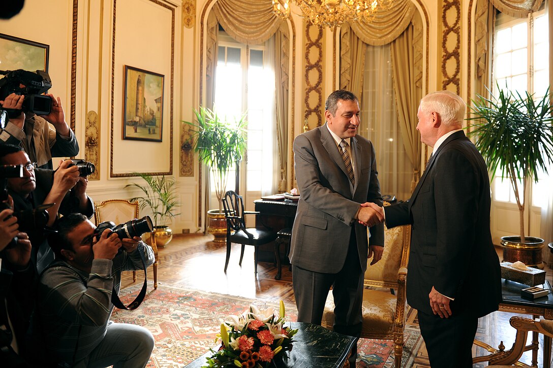U.S. Defense Secretary Robert M. Gates, right, meets with Egyptian Prime Minister Essam Sharaf in Cairo, March 23, 2011.  