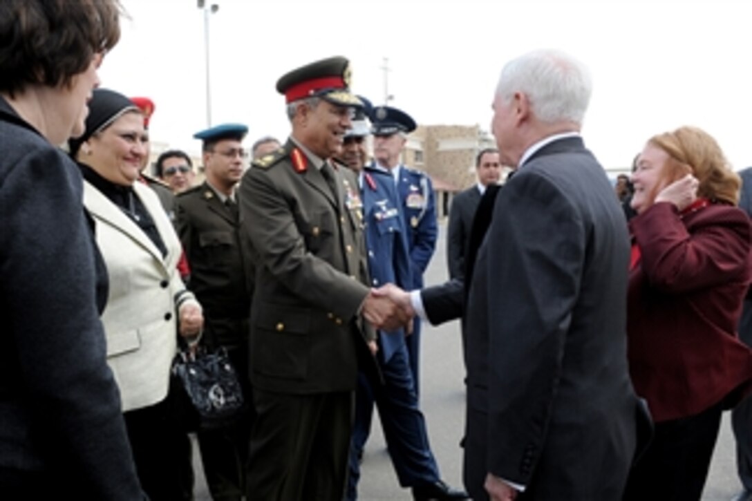 Secretary of Defense Robert M. Gates and his wife Becky (right) are greeted by Egyptian Maj. Gen. Hassan el Rouni after their arrival at the Cairo International Airport on March 23, 2011.  