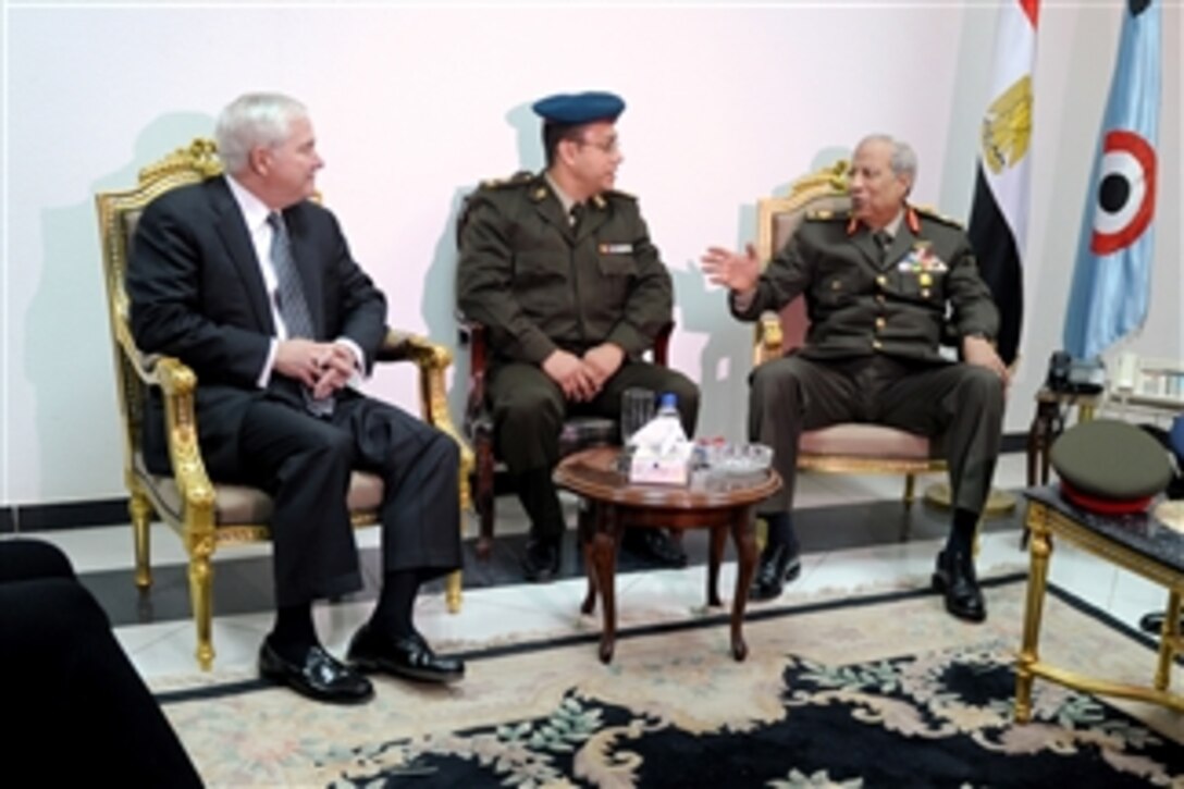 Secretary of Defense Robert M. Gates meets briefly with Egyptian Maj. Gen. Hassan el Rouni after his arrival in Cairo, Egypt, on March 23, 2011.  
