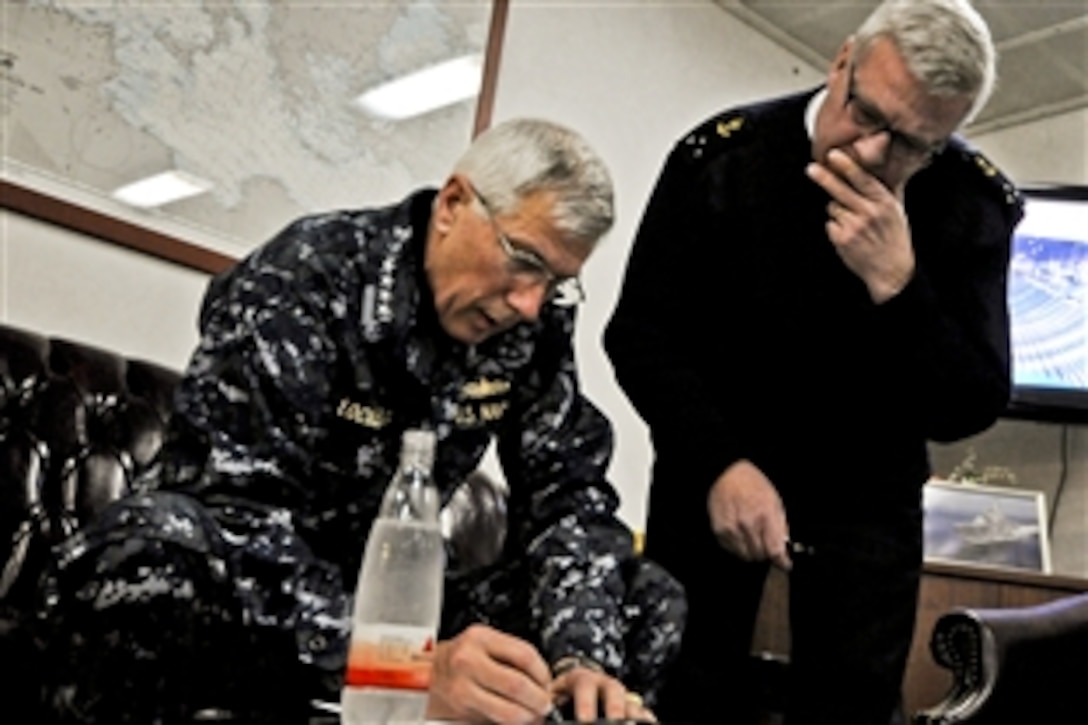 U.S. Navy Adm. Samuel J. Locklear III, left, commander of Joint Task Force Odyssey Dawn, speaks with French navy Vice Adm. Jean-Pierre Labonne in the Mediterranean Sea, March 22, 2011. Joint Task Force Odyssey Dawn is the U.S. Africa Command task force established to provide operational and tactical command and control of U.S. military forces supporting the international response to the unrest in Libya and enforcement of United Nations Security Council Resolution 1973.
