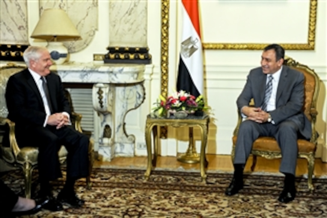 U.S. Defense Secretary Robert M. Gates, left, meets with Egyptian Prime Minister Essam Sharaf in Cairo, March 23, 2011.  