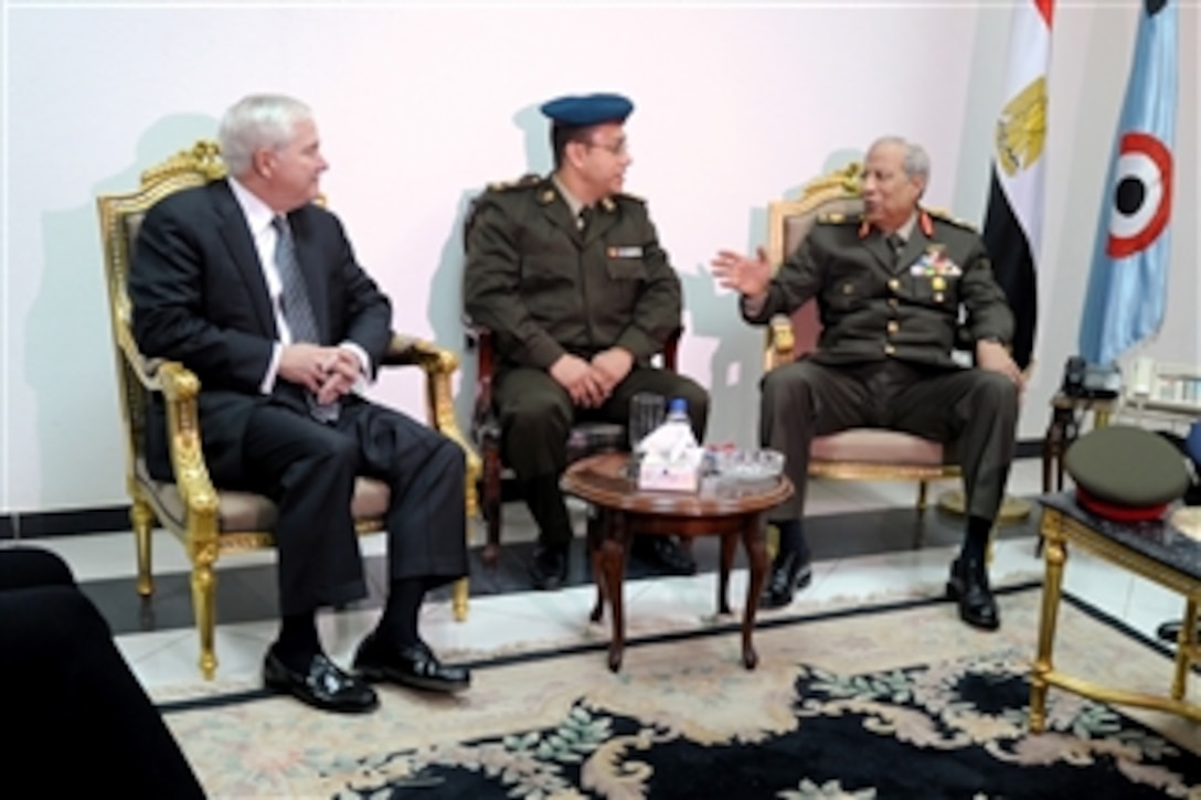 Secretary of Defense Robert M. Gates meets briefly with Egyptian Maj. Gen. Hassan el Rouni after his arrival in Cairo, Egypt, on March 23, 2011.  