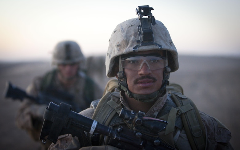 Navy Seaman Amaya Rivera, a corpsman with Fox Company, 2nd Battalion, 3rd Marine Regiment, heads out on patrol in Southern Marjah District, Helmand province, Afghanistan, March 23, the first day of Operation Watchtower. Rivera is from Houston, Texas.