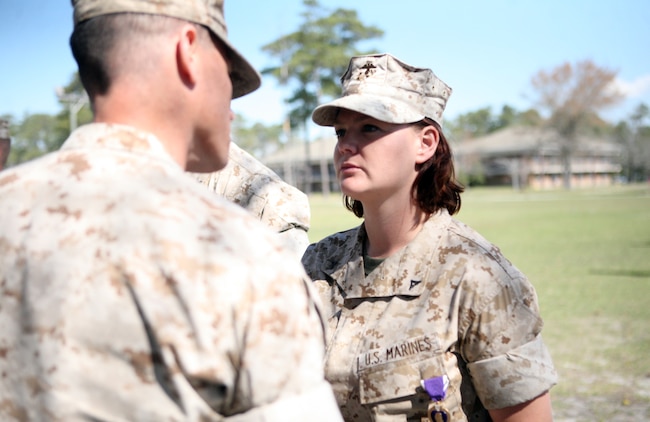 Lance Cpl. Kelly A. White, a combat engineer with Combat Logistics Battalion 2, 2nd Marine Logistics Group, is awarded a Purple Heart Medal during a ceremony aboard Camp Lejeune, N.C., March 24, 2011.  CLB-2 was deployed to Afghanistan in support of International Security Assistance Forces from July 2010 to February 2011.