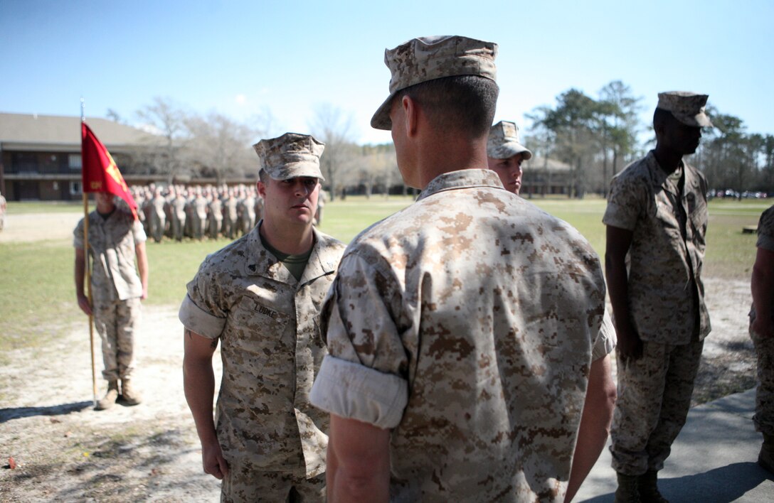 Cpl. Nicholas H. Ludke, a combat engineer with Combat Logistics Battalion 2, 2nd Marine Logistics Group, is awarded a Navy and Marine Corps Achievement Medal with a combat distinguishing device during a ceremony aboard Camp Lejeune, N.C., March 24, 2011.  During the ceremony 13 Marines were recognized for actions while deployed to Afghanistan from July 2010 to February 2011.