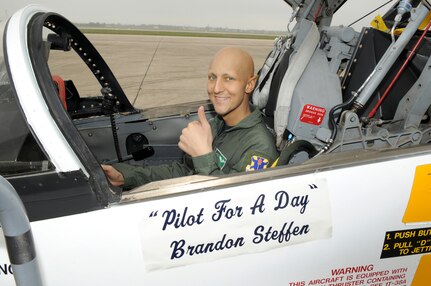 Randolph AFB, TX, 3/24/2011: Brandon Steffen of Oletha, Kansas, gives the thumbs up in the cockpit of a T-38 Talon at the 560th Flying Training Squadron at Randolph Air Force Base, Texas. He toured the squadron  on March 24 in the "Pilot-for-a-Day" program. Brandon's father, Stuart, was formerly a T-38 and B-52  pilot in the U.S. Air Force. (U.S. Air Force photo/David Terry)
