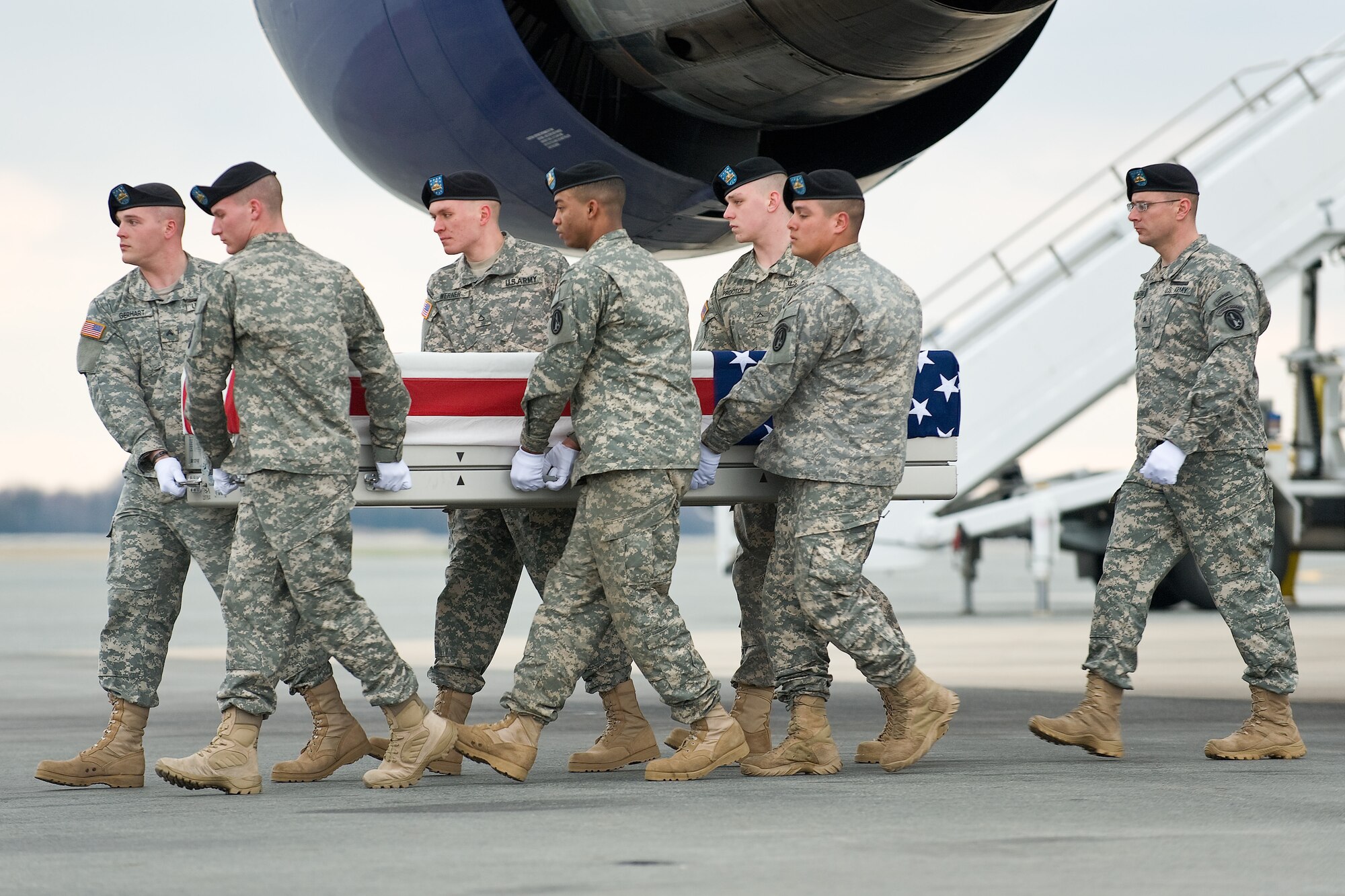 A U.S. Army carry team transfers the remains of Army Pfc. Michael C. Mahr, of Homosassa, Fla., at Dover Air Force Base, Del., March 24, 2011. Mahr was assigned to the 54th Engineer Battalion, 18th Engineer Brigade, Bamberg, Germany. (U.S. Air Force photo/Roland Balik)