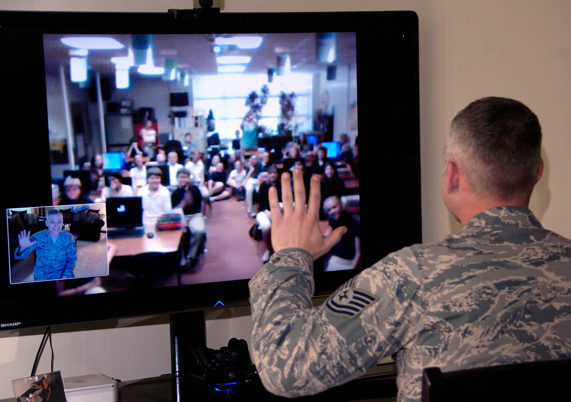 YOKOTA AIR BASE, Japan -- Tech. Sgt. Jason Myers waves to sixth graders at Elsanor Elementary School in Robertsdale, Ala., after a video teleconference to discuss Operation Tomodachi. Their teacher, Jeff Rhodus, had been discussing with his class the recent natural disasters in Japan. Sergeant Myers' son, Miland, is in the class and suggested they talk to his dad since he's stationed at Yokota Air Base, Japan. Sergeant Myers is a structural maintainer with the 374th Maintenance Squadron. (U.S. Air Force photo/ Staff Sgt. J.G. Buzanowski)