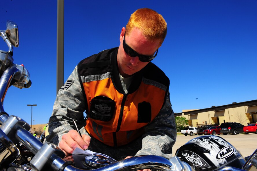 DYESS AIR FORCE BASE, Texas—Staff Sgt. Alistair Adams, 317th Aircraft Maintenance Squadron, goes through a checklist March 23 as he inspects his motorcycle outside Marine Corps Detachment-1 prior to a 317th Airlift Group sponsored motorcycle ride here. There were many participants to include members from the Green Knights chapter 63, a military motorcycle club specifically for Dyess Airmen, dependents, DoD civilians and retirees. At this event riders received safety inspections, briefs and participated in a 40-minute ride. The reason for this ride was to highlight the practical application of motorcycle safety skills such as the proper safety gear, defensive riding and riding through different types of terrain. For more information on safety  regulations or the Green Knights refer to AFI 91-207, The U.S. Air Force Traffic Safety Program, or log on to www.texasgreenknights.org. (U.S. Air Force photo/ Airman First Class Courtney Moses)