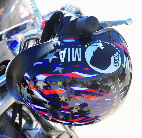 DYESS AIR FORCE BASE, Texas—A helmet hangs on the handle bars of a motorcycle March 23 outside Marine Corps Detachment-1 prior to a 317th Airlift Group sponsored motorcycle ride here. Participants included members from the Green Knights Chapter 63, a military motorcycle club specifically for Dyess Airmen, dependents, DoD civilians and retirees. Riders received safety inspections, briefs and participated in a 40-minute ride. The reason for this ride was to highlight the practical application of proper safety gear, defensive riding and riding through different types of terrain. For more information on safety regulations refer to AFI 91-207, The U.S. Air Force Traffic Safety Program, or for more information on the Green Knights, log on to www.texasgreenknights.org. (U.S. Air Force photo/ Airman First Class Courtney Moses)