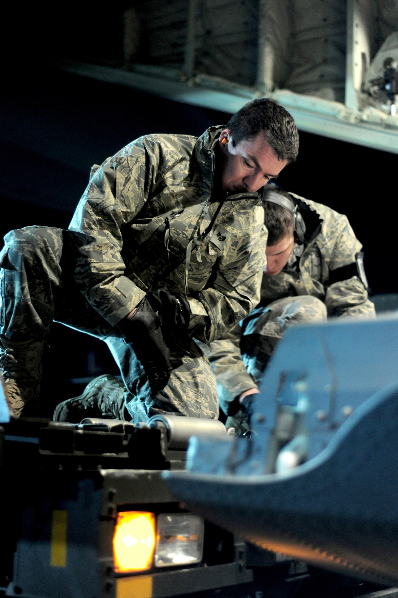 SPANGDAHLEM AIR BASE, Germany ? Airmen from the 726th Air Mobility Squadron prepare to load cargo onto a C-130J Super Hercules here in support of Operation Odyssey Dawn March 20.  Joint Task Force Odyssey Dawn is the U.S. Africa Command task force established to provide operational and tactical command and control of U.S. military forces supporting the international response to the unrest in Libya and enforcement of United Nations Security Council Resolution (UNSCR) 1973. UNSCR 1973 authorizes all necessary measures to protect civilians in Libya under threat of attack by Qadhafi regime forces.  JTF Odyssey Dawn is commanded by U.S. Navy Admiral Samuel J. Locklear, III. (U.S. Air Force photo/Senior Airman Nathanael Callon)