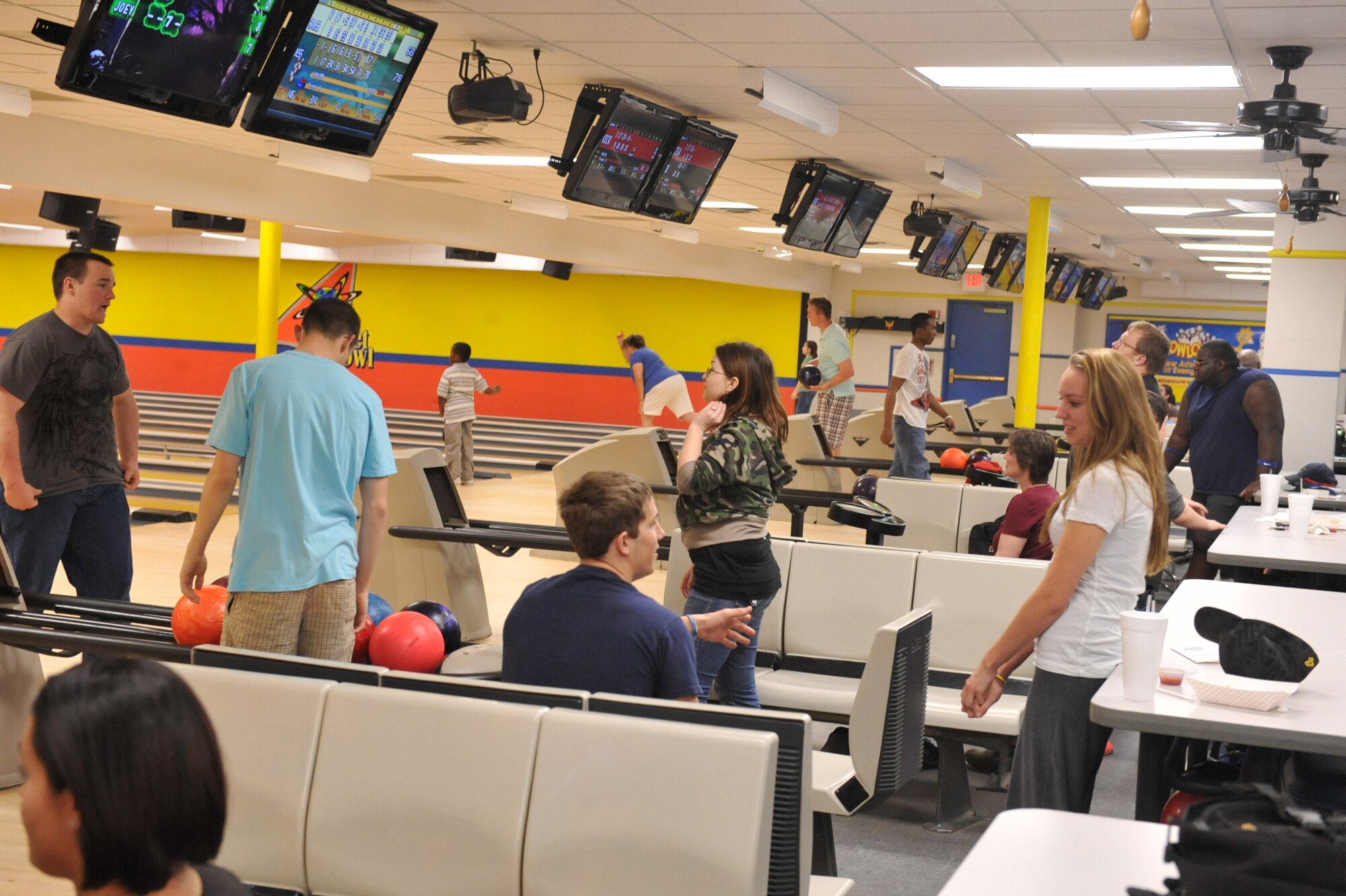 SEYMOUR JOHNSON AIR FORCE BASE, N.C. -- Members of Team Seymour attends Penny-a-Pin night at Planet Bowl, March 23, 2011. On average 25 to 35 people come to Penny-a-Pin night, held every Wednesday bowl, play arcade games and enjoy the snack bar. (U.S. Air Force photo/Senior Airman Whitney Lambert) (RELEASED) 
