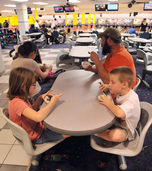 SEYMOUR JOHNSON AIR FORCE BASE, N.C. -- Airman 1st Class Jennifer Gorum and her family enjoy a scoop of ice cream after bowling at Planet Bowl here, March 23, 2011. The Gorums go bowling twice a month to reward the children for their hard work at school. Airman Gorum, native of Lillington, is a 4th Component Maintenance Squadron aerospace propulsion apprentice. (U.S. Air Force photo/Senior Airman Whitney Lambert) (RELEASED)