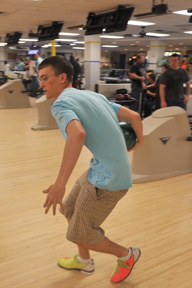 SEYMOUR JOHNSON AIR FORCE BASE, N.C.-- Airman 1st Class Jonathan Crews prepares to roll a ball down a lane at Planet Bowl, March 23, 2011. Wednesdays are Penny-a-Pin night from 5 - 9 p.m. and customers pay what they score. Airman Crews, 911th Air Refueling Squadron crew chief, hails from Ft. Myers, Fl. (U.S. Air Force photo/Senior Airman Whitney Lambert) (RELEASED)