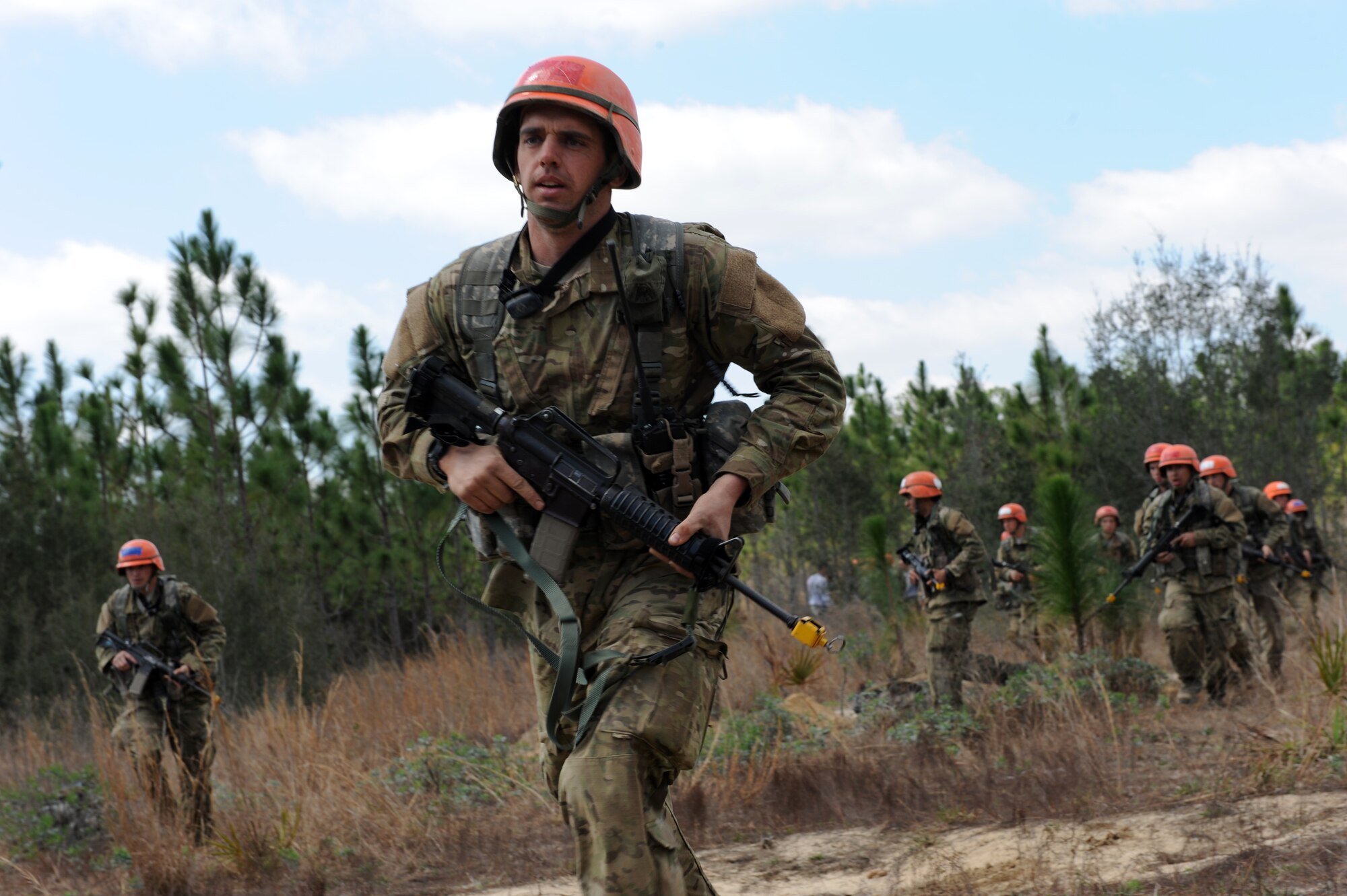 Staff Sgt. Jason Brunson, U.S. Air Force Tactical Air Control Party candidate from Falcon Flight 86 runs to his bunker during a simulated air attack durinf a field training exercise, Eglin Air Force Base Range, Fla., March 10, 2011. The week-long FTX is a culminination of everything Falcon Flight 86 has learned thus far in training , testing the class both physically and mentally.(U.S. Air Force photo by Airman 1st Class Caitlin O'Neil-McKeown/ RELEASED)