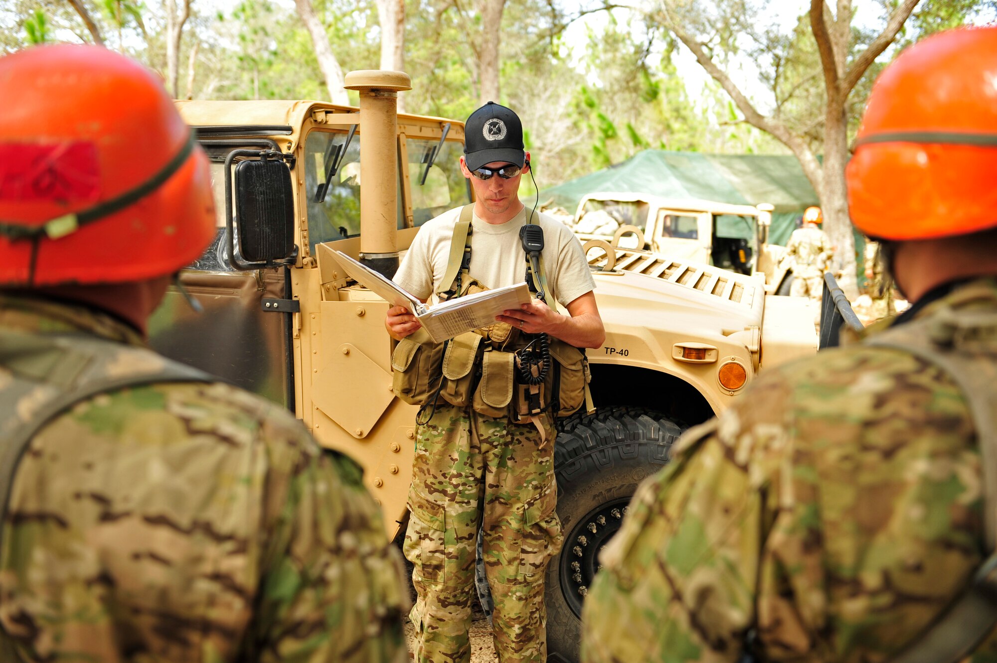 Tech. Sgt. David Blackmore, U.S. Air Force Tactical Air Control Party instructor, briefs members of Falcon Flight 86 on the rules of land navigation during a field training exercise, Eglin Air Force Base Range, Fla., March 8, 2011. The week-long FTX is the culmination of everything Falcon Flight 86 has learned thus far in training, testing the class both physically and mentally. (U.S. Air Force photo by Staff Sgt. Stephanie Jacobs/RELEASED)

