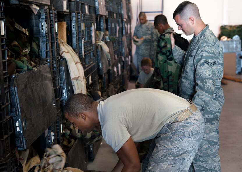 MOODY AIR FORCE BASE, Ga. -- Members of the 23rd Logistics Readiness Squadron issue gear during a mass-equipment issue March 24. The 23rd LRS IPE flight dedicated two days to ensure personnel had the proper training gear needed for the upcoming operational readiness exercise. (U.S. Air Force photo/Airman 1st Class Douglas Ellis)(RELEASED)
