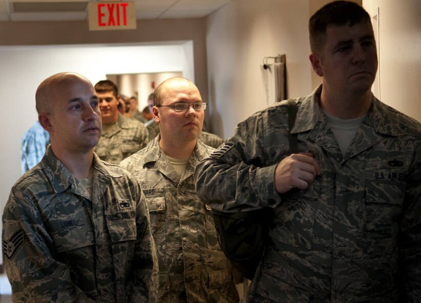 MOODY AIR FORCE BASE, Ga. -- Base personnel wait in line to receive individual protection equipment during a mass-equipment issue March 24. The 23rd Logistic Readiness Squadron IPE flight issued gear in preparation for the upcoming operational readiness exercise. (U.S. Air Force photo/Airman 1st Class Douglas Ellis)(RELEASED)
