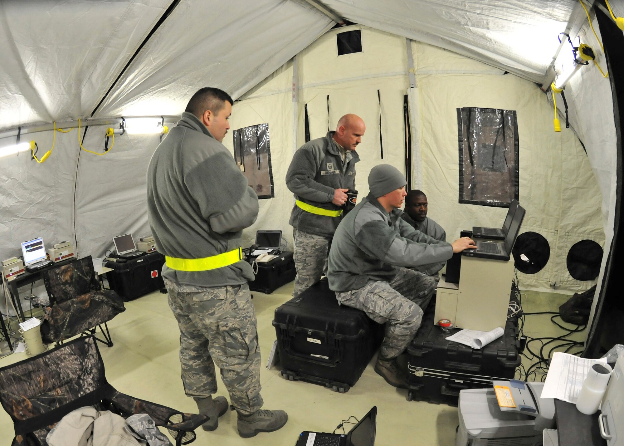 YOKOTA AIR BASE, Japan -- Members of the Air Force Radiation Assessment Team test water samples for possible radiation exposure here March 25. The AFRAT currently supports Operation Tomodachi by ensuring the local water supply is safe for use.  (U.S. Air Force photo/Airman 1st Class Andrea Salazar)