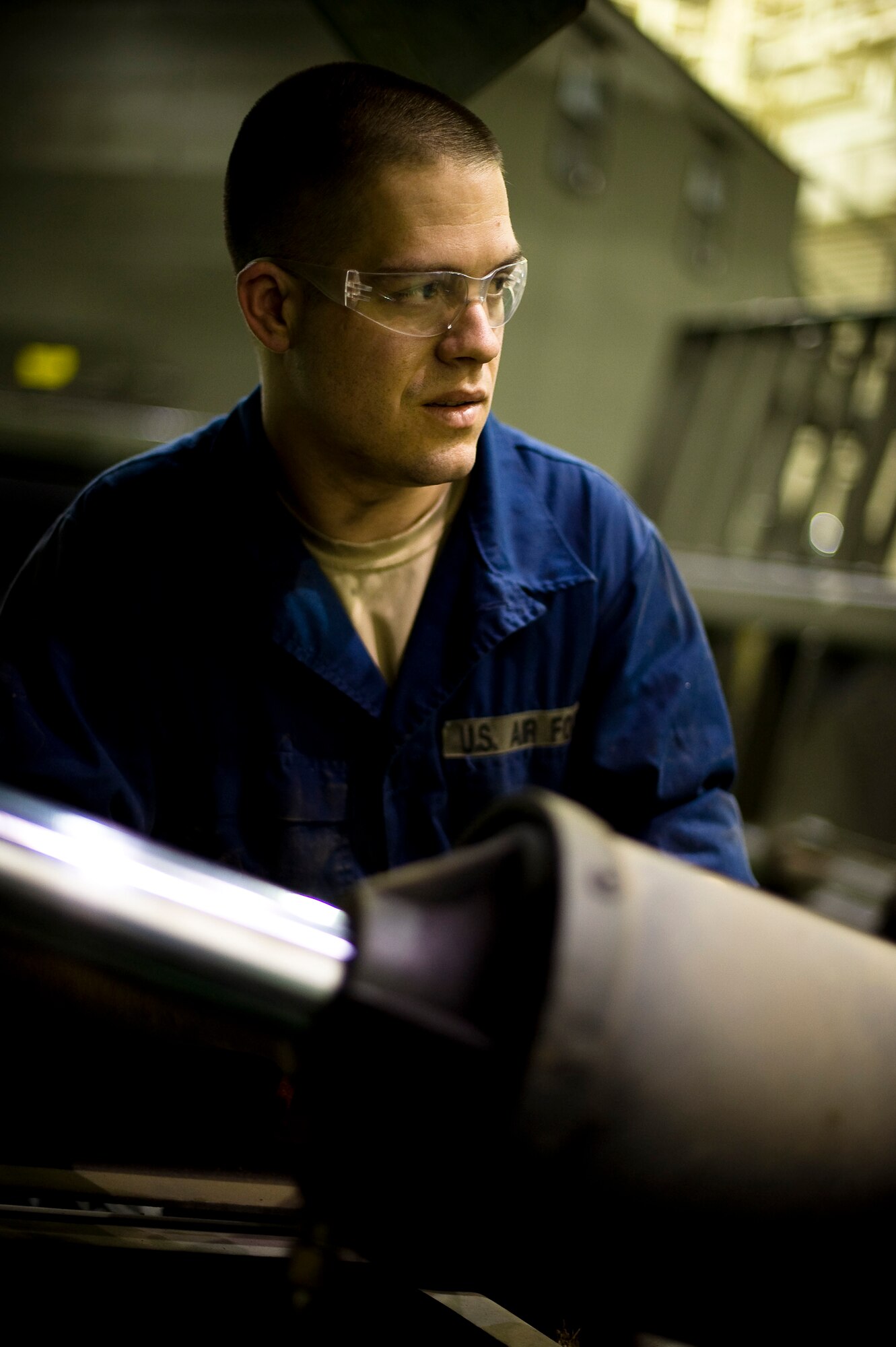 YOKOTA AIR BASE, Japan -- Senior Airman Christopher Nichols, 673rd Logistics Readiness Squadron vehicle maintenance specialist, stationed out of Elmendorf Air Force Base, Alaska, test the hydraulic lines for leaks on a truck here March 23. Airman Nichols and 10 other of his coworkers from Elmendorf volunteered to help out Yokota's Logistics Readiness Squadron in part of the relief effort. "I am very honored to be in Japan during this time. I just want to do my part and make sure everyone is taken care of." (U.S. Air Force photo/Staff Sgt. Chad C. Strohmeyer)