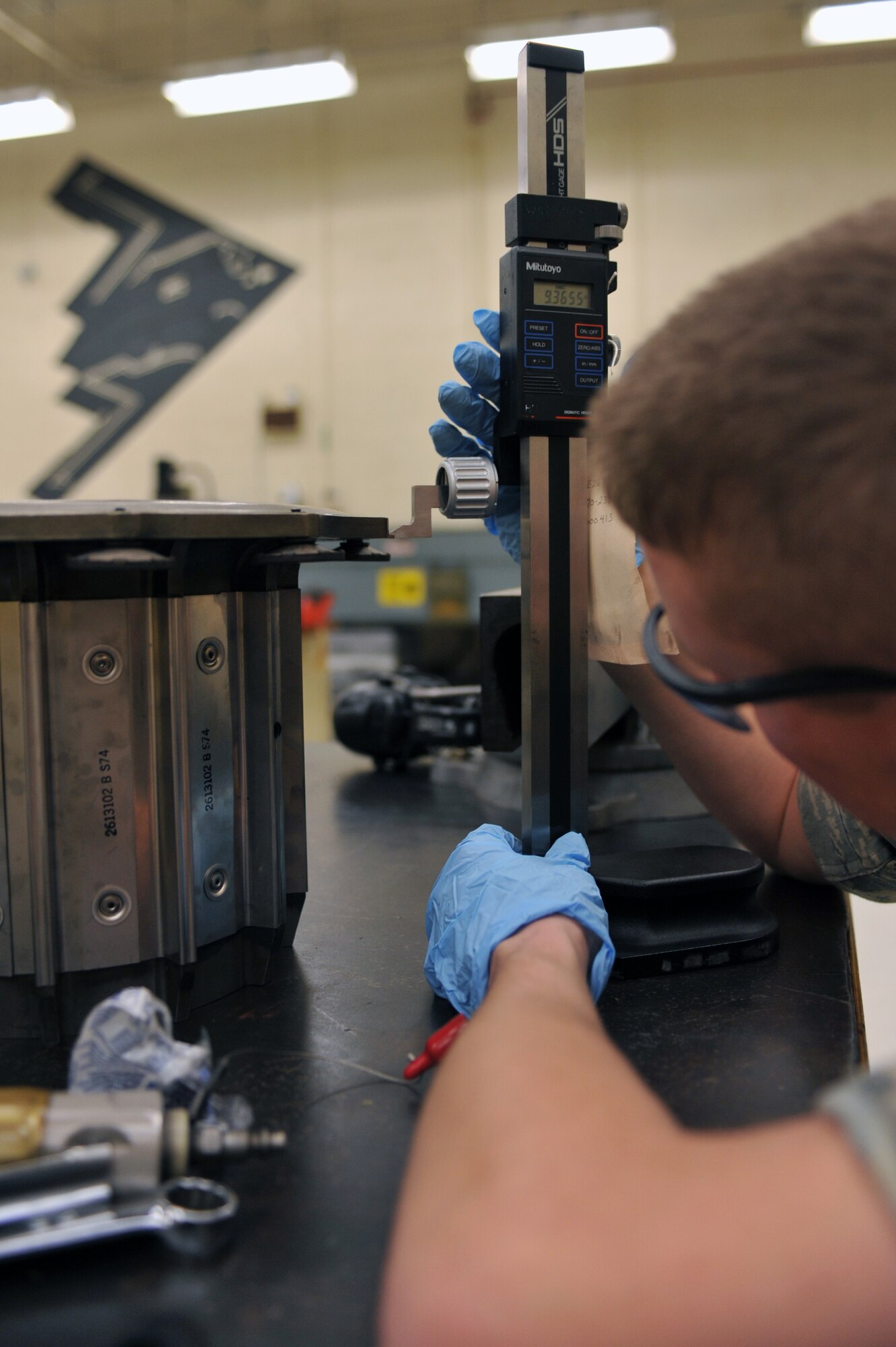 WHITEMAN AIR FORCE BASE, Mo. -- Airman 1st Class Travis Dowler, 509th Maintenance Squadron hydraulic systems apprentice, measures a torque tube from a B-2 Spirit brake system March 22, 2011. Airman Dowler received on-the-job training to repair B-2 brake systems during their daily operations. (U.S. Air Force photo by Tech. Sgt. Charles Larkin Sr)