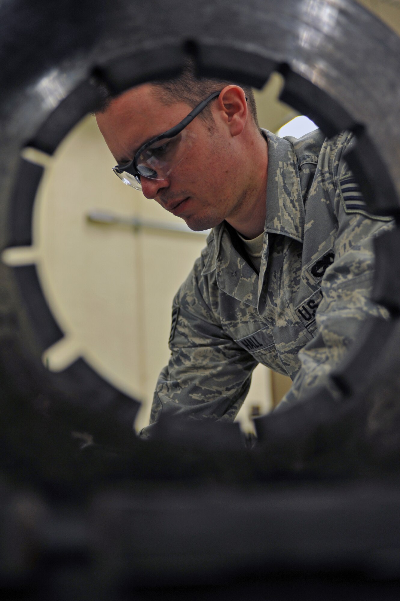 WHITEMAN AIR FORCE BASE, Mo. -- Staff Sgt. David Hall, 509th Maintenance Squadron hydraulic systems journeyman, writes down the measurements from a heat stack of a B-2 Spirit brake system March 22, 2011. Sergeant Hall provided on-the-job training to two Airmen on the proper repair procedures for the B-2's brake system. (U.S. Air Force photo by Tech. Sgt. Charles Larkin Sr)