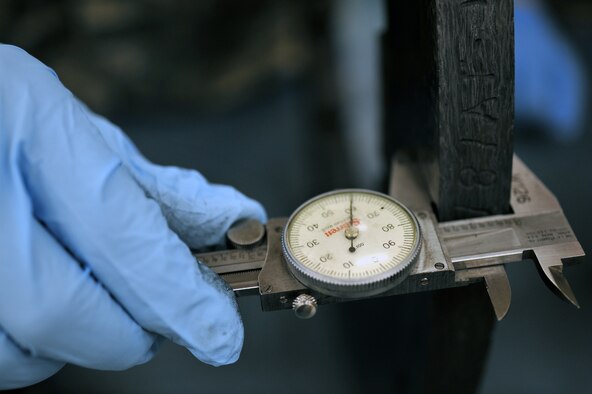 WHITEMAN AIR FORCE BASE, Mo. -- Airmen from the 509th Maintenance Squadron hydraulics back-shop measure tolerances on a heat stack from a B-2 Spirit brake system March 22, 2011. The Airmen repair B-2 brake systems, fabricate hydraulic lines and operate test equipment during their daily operations. (U.S. Air Force photo by Tech. Sgt. Charles Larkin Sr)