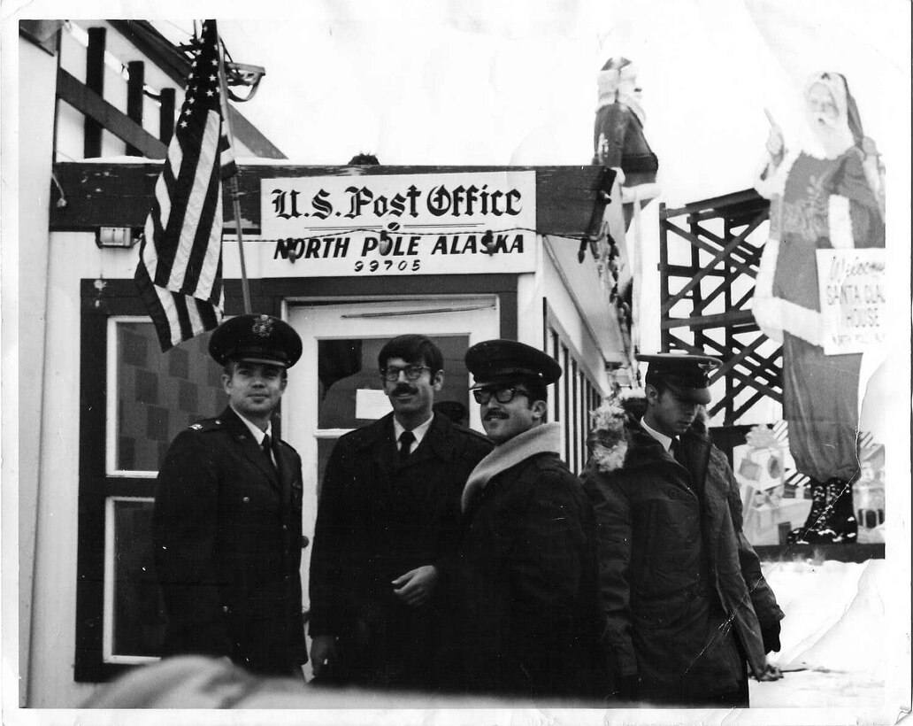 Members of The United States Air Force Band's Singing Sergeants pose for a photograph on a 1971 trip to North Pole, Alaska. Pictured (from left): Capt. Robert Kuzminski (director), Tech Sgts. Marvin Finnley, Wally Watson, and Josue Bustos.  If you have additional info, please email our Band Historian <a href="mailto:usafbandhistorian@afncr.af.mil">Tech. Sgt. Tracey MacDonald</a>. Thank you and we look forward to hearing from you!  This is Photo 44. (Unknown Photographer)