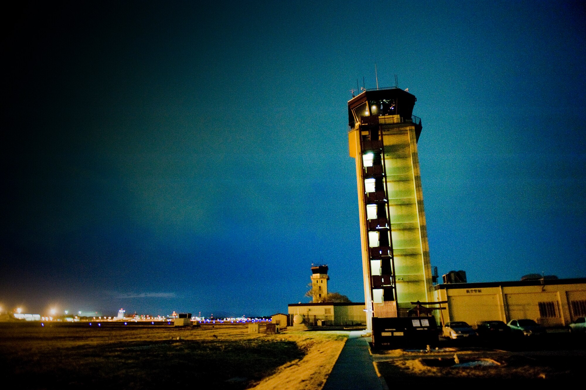 YOKOTA AIR BASE, Japan -- The air traffic controller tower over looks entire flight line here March 24. Yokota's flight line has received over triple the normal amount of aircraft due to Operation Tomodachi. The military and civilian aircraft have been from multiple nations carrying supplies, personnel and equipment in direct support of bringing relief efforts and trying to minimize human suffering. (U.S. Air Force photo/Staff Sgt. Jonathan Steffen)