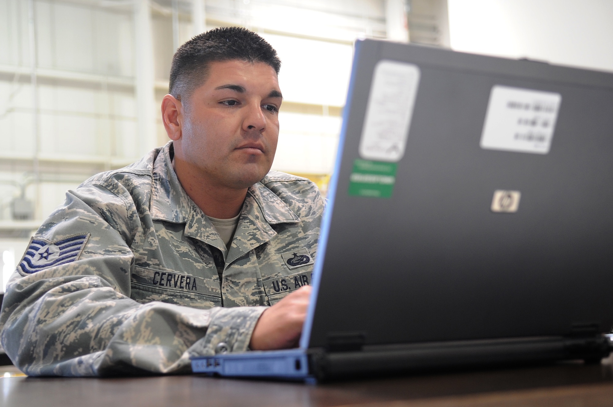 BUCKLEY AIR FORCE BASE, Colo.-- TSgt Ronald Cervera from the 460th Force Support Squadron, helps the personnel processing line for Operation Pacific Passage March 23, 2011. The processing line was set up at Denver International Airport Joint Reception Coordination Center. (U.S. Air Force photo by Airman Manisha Vasquez)