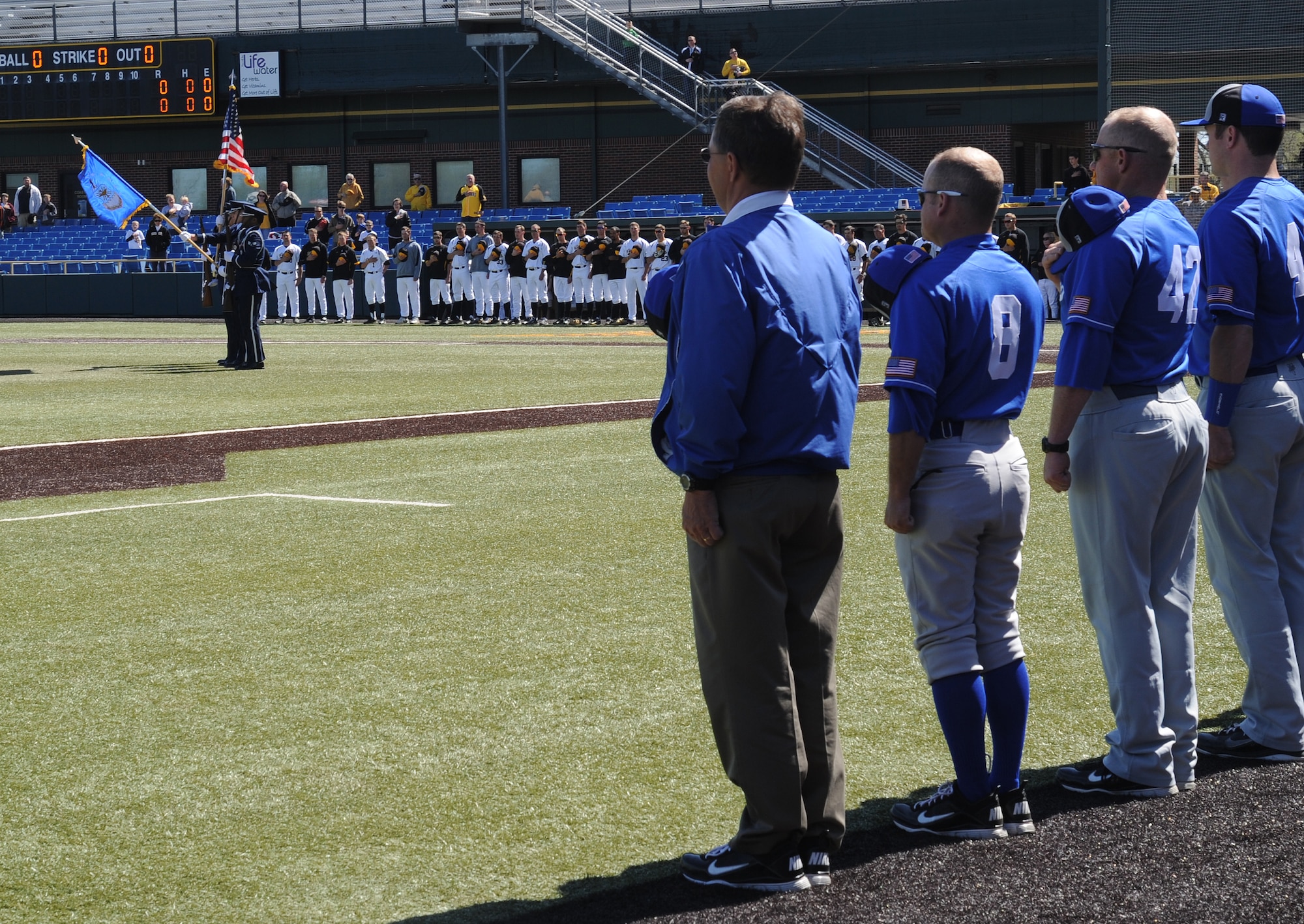McConnell’s Honor Guard presents the colors during the National Anthem before the Wichita State University versus U.S. Air Force Academy baseball game at Eck Stadium, March 23, 2011, Wichita, Kan.  At the academy, every cadet is considered an athlete and is required to participate in the intercollegiate level, or in the intramural program. The USAFA Falcons lost to the WSU Shockers. The loss dropped the Falcons to 11-12 for the season. (U.S. Air Force photo/Airman 1st Class Katrina M. Brisbin)