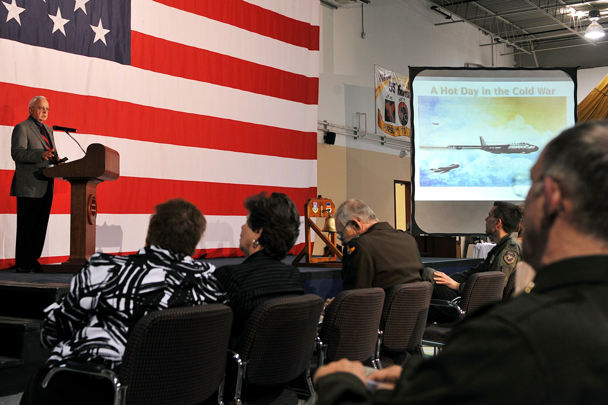 OFFUTT AIR FORCE BASE, Neb. - Hank Dubuy, who was a RB-47H copilot in 1965, talks to team Offutt about one of his reconnaissance mission during the Cold War as a part of the Tales of the 55th ceremony at the James M. McCoy Airman Leadership School April 9, 2010. The event held in conjunction with the 55th Wing Heritage Week, gave Team Offutt a chance to reflect on its heritage and hear stories from those who answered their nation call. U.S. Air Force photo by Charles Haymond