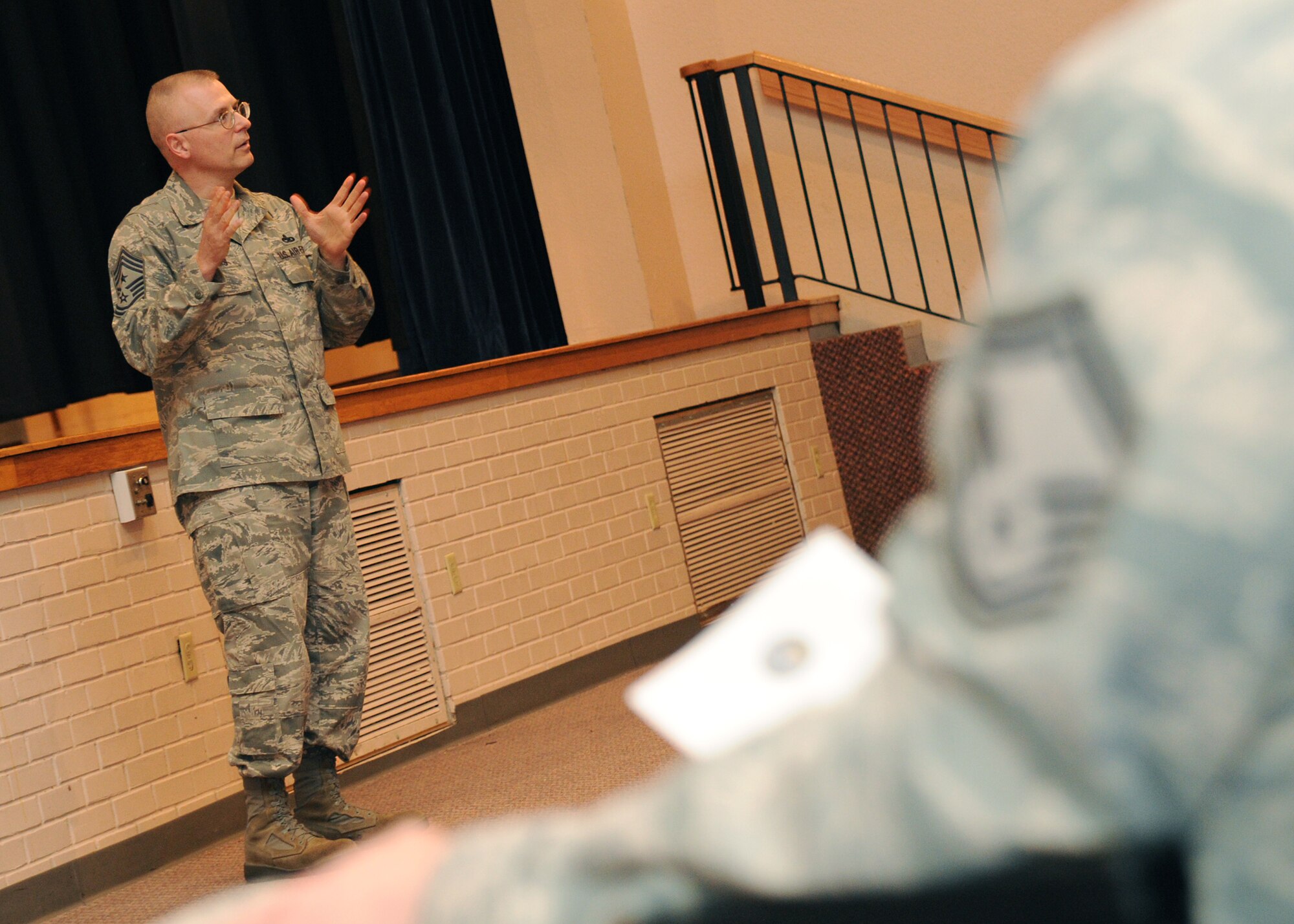 Chief Master Sgt. Jeffrey Williams, 18th Air Force command chief, speaks to McConnell’s senior non-commissioned officers at the base theater March 16, 2011, McConnell Air Force Base, Kan. Sergeant Williams gathered the SNCOs to an all-call, addressing any concerns affecting McConnell’s enlisted force. Chief Williams is the primary advisor to the 18th Air Force commander on matters such as the welfare, health and morale of more than 51,000 total force personnel. (U.S. Air Force photo/Senior Airman Maria A. Ruiz