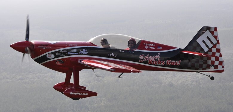 Nicole Goetz, 17, flies with Greg Poe in the ethanol-powered Fagen MXS over Panama City, Fla., March 23. Nicole was recently selected as the United States Air Force Military Child of the Year and was awarded a flight in air show performer Greg Poe’s aerobatic airplane. (U.S. Air Force photo by Airman 1st Class Christopher Reel)  