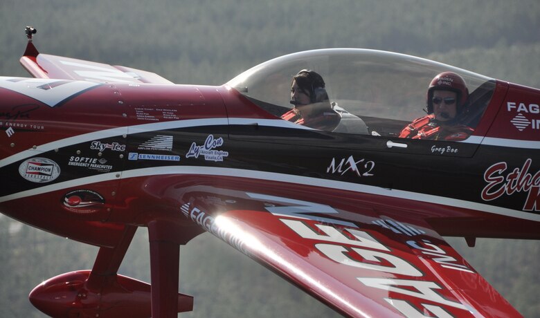 Nicole Goetz, 17, flies with Greg Poe in the ethanol-powered Fagen MXS over Panama City, Fla., March 23. Nicole was recently selected as the United States Air Force Military Child of the Year and was awarded a flight in air show performer Greg Poe’s aerobatic airplane. (U.S. Air Force photo by Airman 1st Class Christopher Reel)