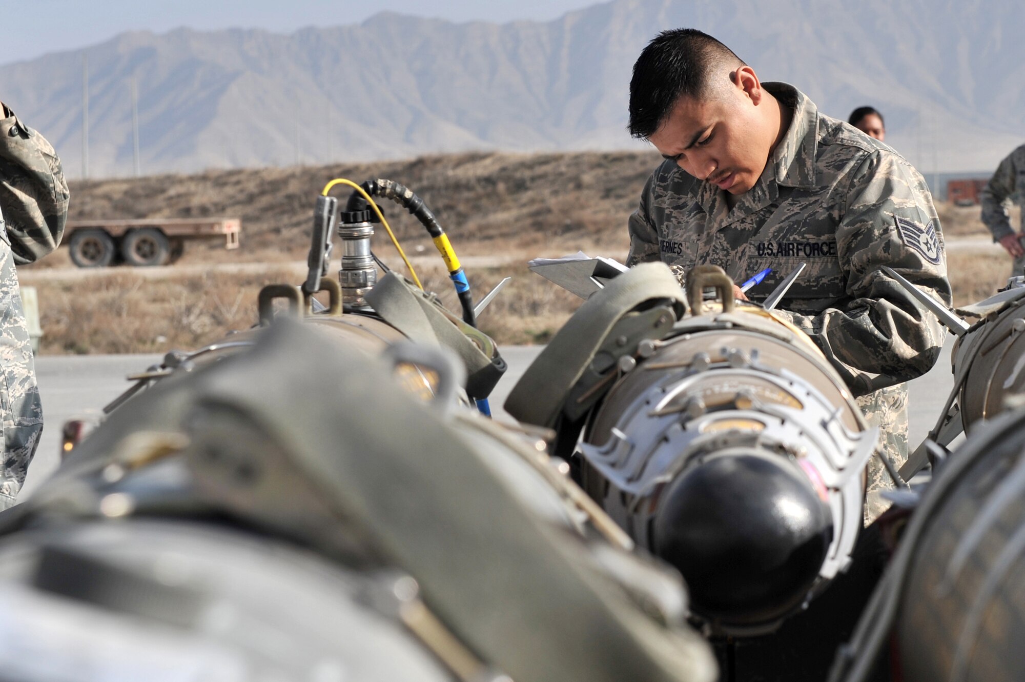 Staff Sgt. Raul Viernes goes through a post-load checklist March 23, 2011, at Bagram Airfield, Afghanistan. Sergeant Viernes ensured there were no discrepancies on a GBU-54 joint direct attack munition. Sergeant Vierness is an ammunition supply point technician assigned to the 455th Expeditionary Maintenance Squadron. (U.S. Air Force photo/Senior Airman Sheila deVera)