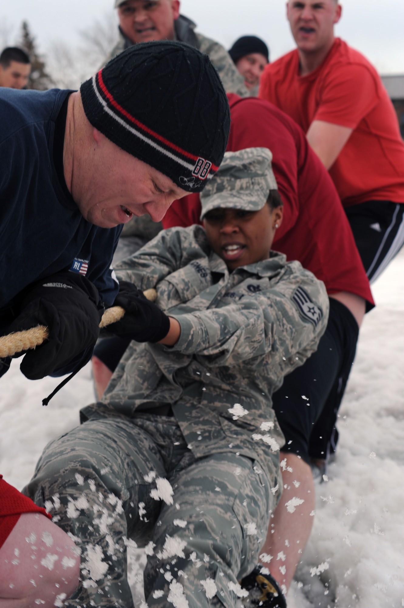 Staff Sgt. Krystal Jones, 319th Civil Engineering Squadron, fights for leverage during a game of tug-of-war Mar. 17 outside the base fitness center during the base’s annual Winter Bash competitions. (U.S. Air Force photo by Airman 1st Class Amber Bennett)