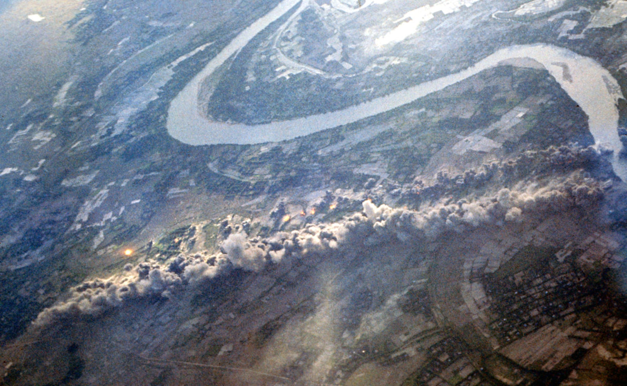 Bombs from a B-52 on an ARC LIGHT mission hitting communist troop positions. (U.S. Air Force photo)