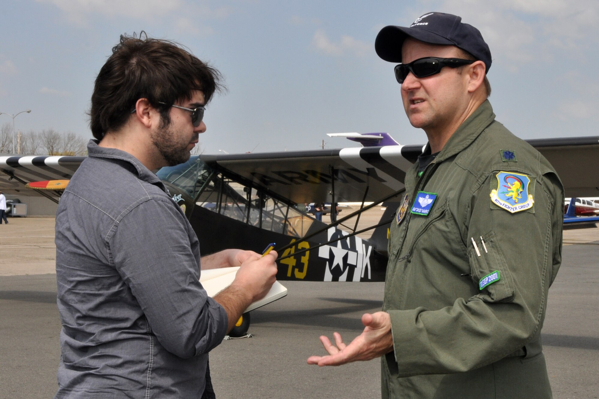 Adam Duvernay, who is a reporter for the Shreveport Times, interviews Lt. Col. James Marks, commander, 917th Operations Support Flight, at the “Wings Over The Red Fly-In and Airport Open House” hosted by the Experimental Aircraft Associate, Chapter 343 at the Shreveport Downtown Airport in Shreveport, La., March 19, 2011. More than 24 static displays were available for visitors to view at the event. (U.S. Air Force photo/Tech. Sgt. Jeff Walston)