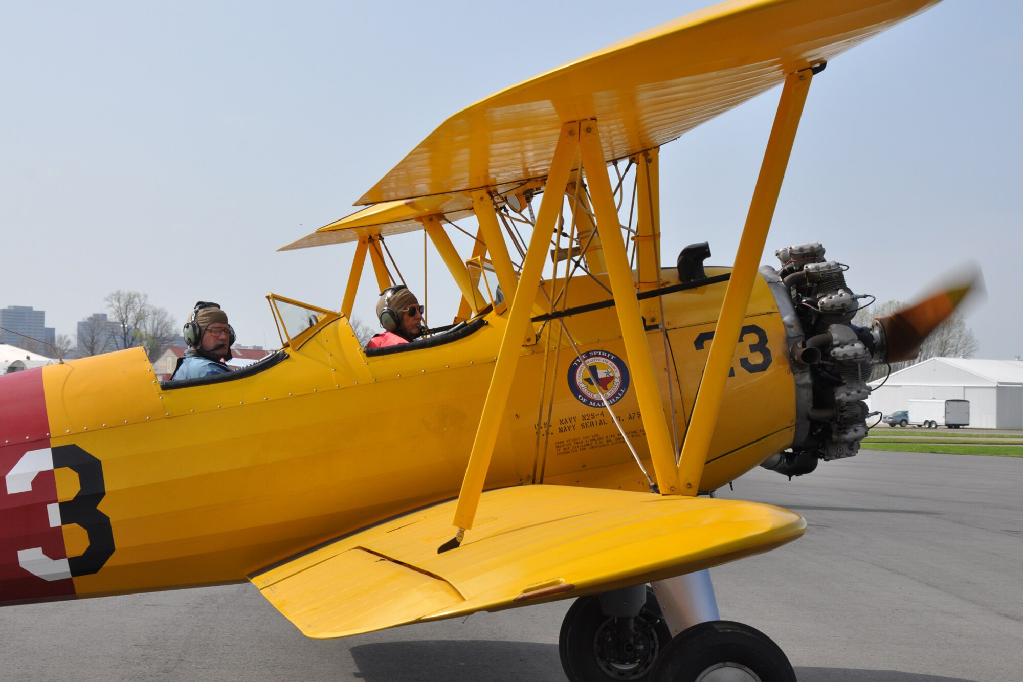 Lt. Col. Mark T. Olson, (left) chief of safety, 917th Fighter Group, taxis a Boeing Stearman PT-17 to a parking spot at the “Wings Over The Red Fly-In and Airport Open House” hosted by the Experimental Aircraft Associate, Chapter 343 at the Shreveport Downtown Airport in Shreveport, La., March 19, 2011. The aircraft was used in World War II as a trainer for pilots before they moved on to more advanced aircraft in their pilot training. Colonel Olson is an Air Force Reserve pilot assigned to the 917th FG at Barksdale Air Force Base, La., and flew the aircraft to the event for the Commemorative Air Force, so it could be displayed with more than 24 other aircraft for visitors to view at the event. (U.S. Air Force photo/Tech. Sgt. Jeff Walston)